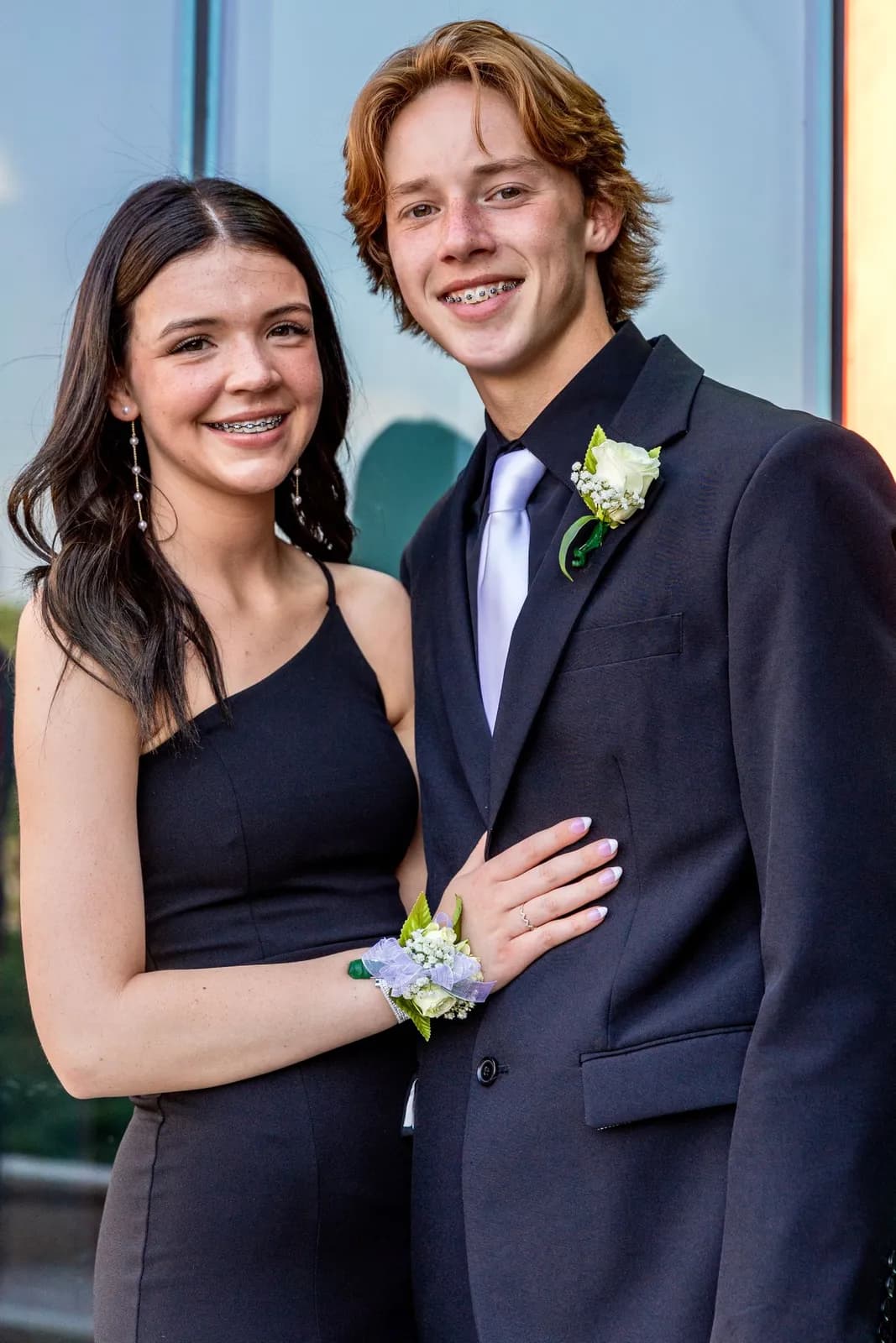 Couple photographed on the red carpet at a school formal